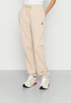 Jordan PANT CORE - Pantalones Deportivos - Sanddrift , Mujer
