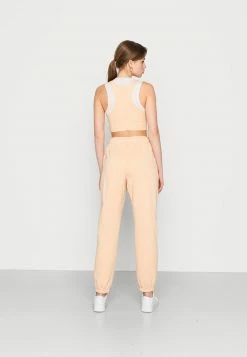 Jordan PANT CORE - Pantalones Deportivos - Orange, Mujer -Jordan Tienda Oficial b1491a1782bb4197bf3a3e1ff7870ec2